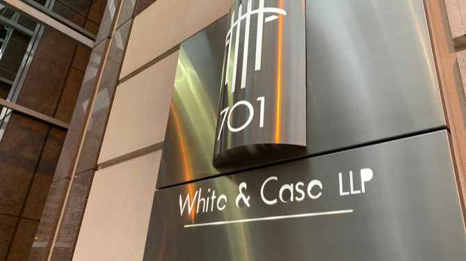 WASHINGTON - FEBRUARY 26, 2020: WHITE & CASE LLP sign at entrance to law firm